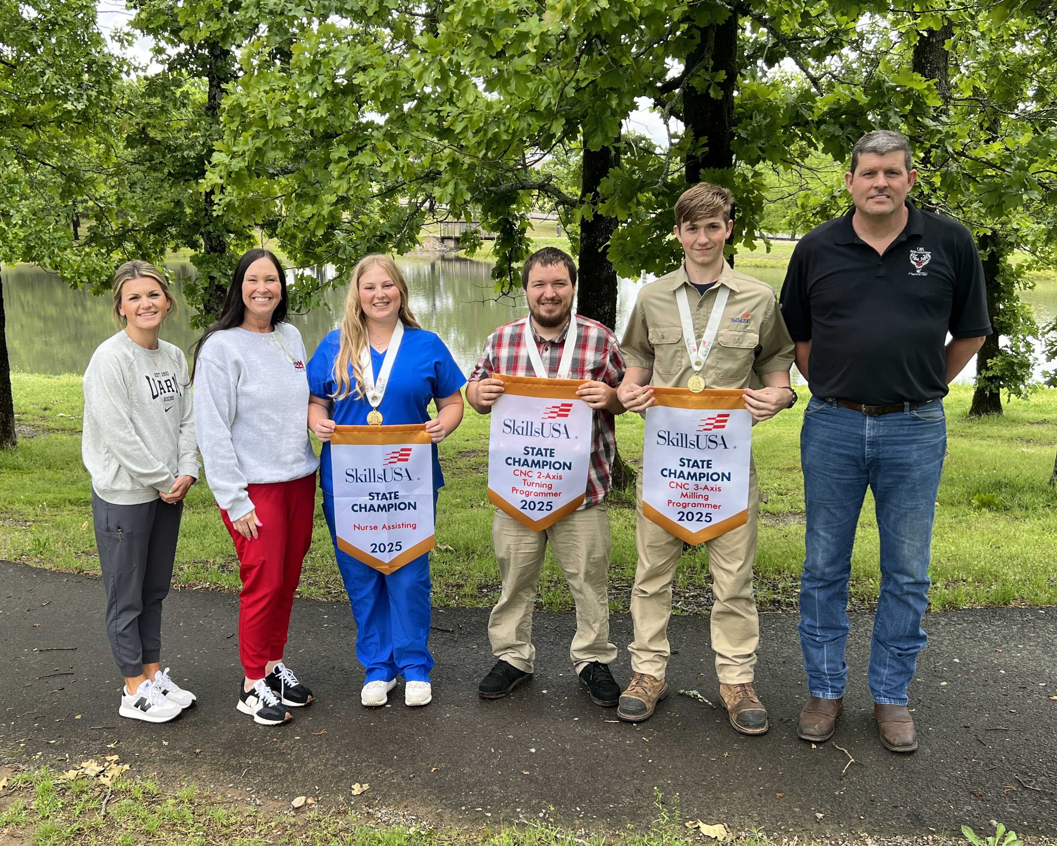Instructors, Summer DePriest, Minta Milham and Johnathan Lunsford with champions, Lily Rowland, Robin Lehnerd and Solomon Parks